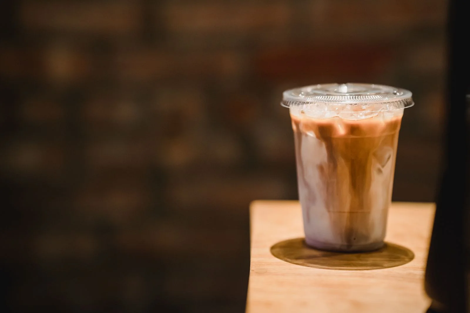 Iced coffee catching a warm patch of afternoon light